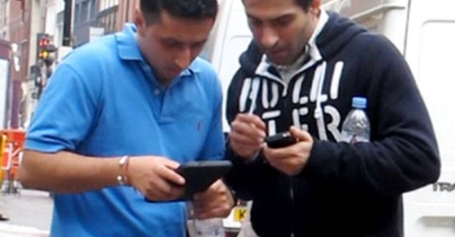 Men consulting GPS tablet